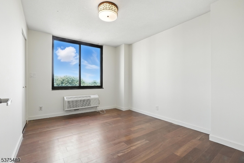 316 Prospect Avenue, Unit A Hackensack, NJ 07601 - Photo 13 of 18 an empty room with windows