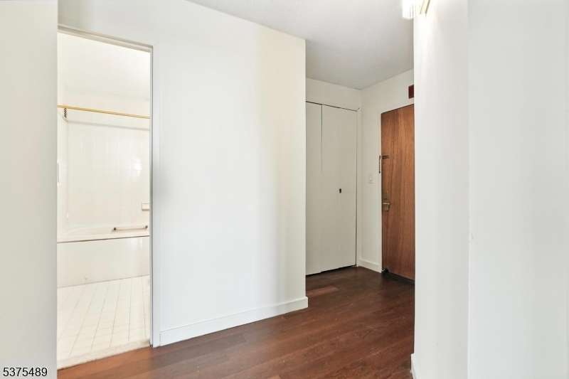 316 Prospect Avenue, Unit A Hackensack, NJ 07601 - Photo 9 of 18 a view of hallway with wooden floor
