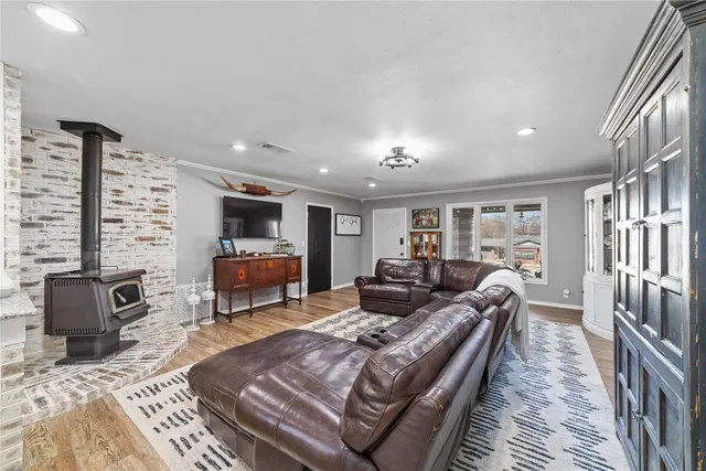 a living room with furniture fireplace and flat screen tv