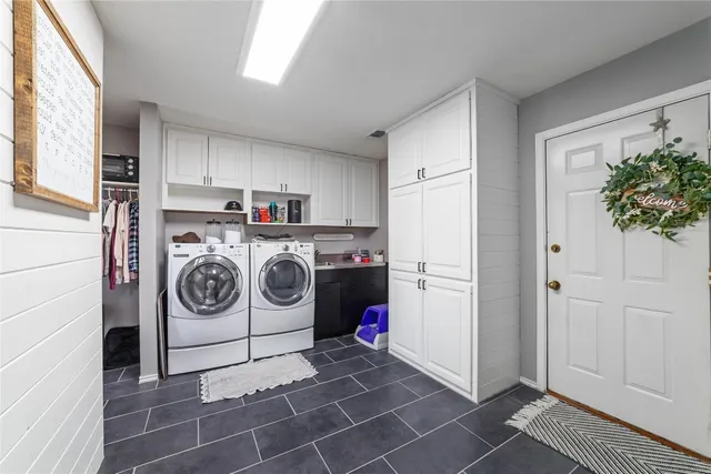 a utility room with dryer and washer