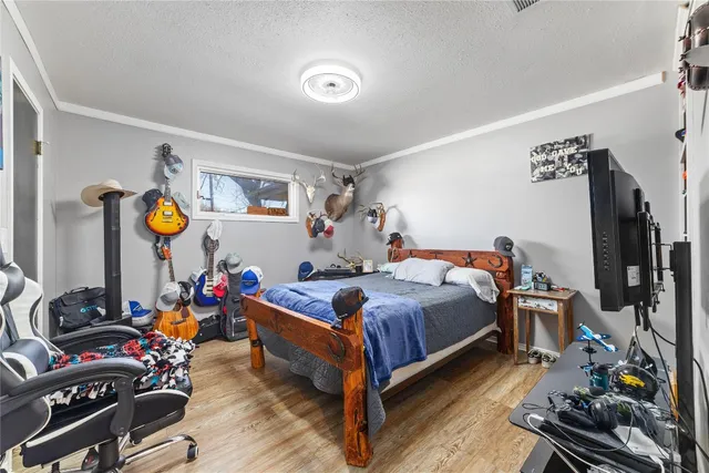 a bedroom with bed and a window