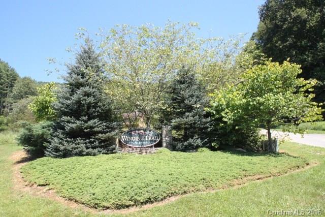 7-9 Gambrell Hill Road, Unit 79 Clyde, NC 28721 - Photo 14 of 24 a backyard of a house with trees and outdoor seating