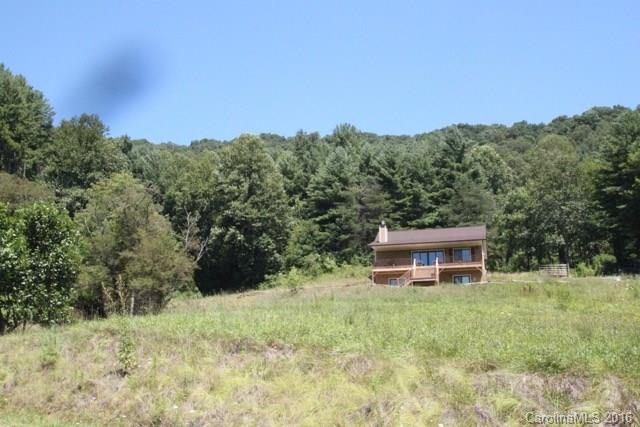 7-9 Gambrell Hill Road, Unit 79 Clyde, NC 28721 - Photo 24 of 24 a view of a house with a yard