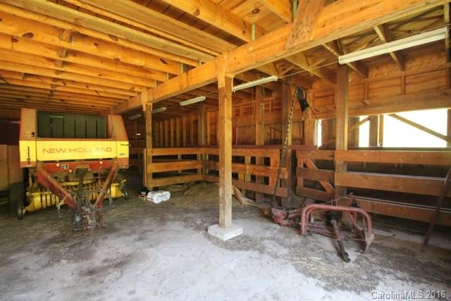 7-9 Gambrell Hill Road, Unit 79 Clyde, NC 28721 - Photo 4 of 24 a view of a room with wooden chairs
