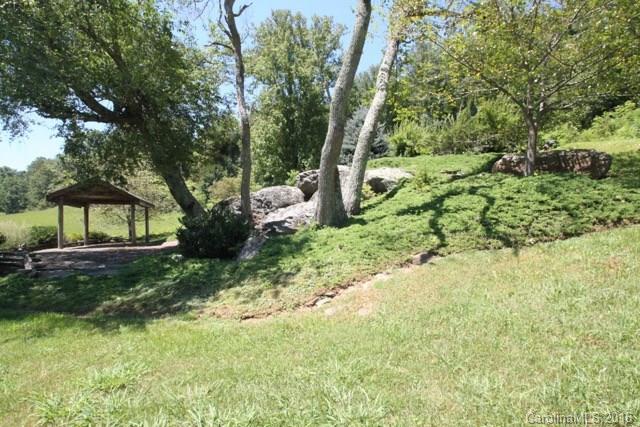 7-9 Gambrell Hill Road, Unit 79 Clyde, NC 28721 - Photo 9 of 24 a view of a garden with a tree