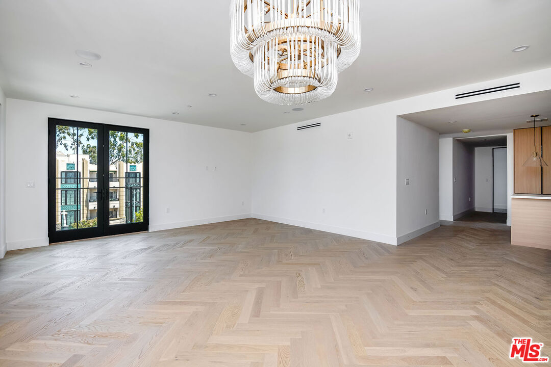 10352 Riverside Drive, Unit 301 Toluca Lake, CA 91602 - Photo 11 of 19 a view of an empty room with a window