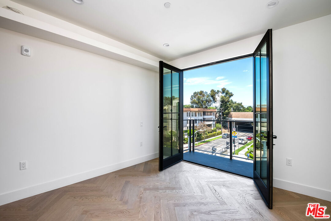 10352 Riverside Drive, Unit 301 Toluca Lake, CA 91602 - Photo 12 of 19 a view of a room with a large window