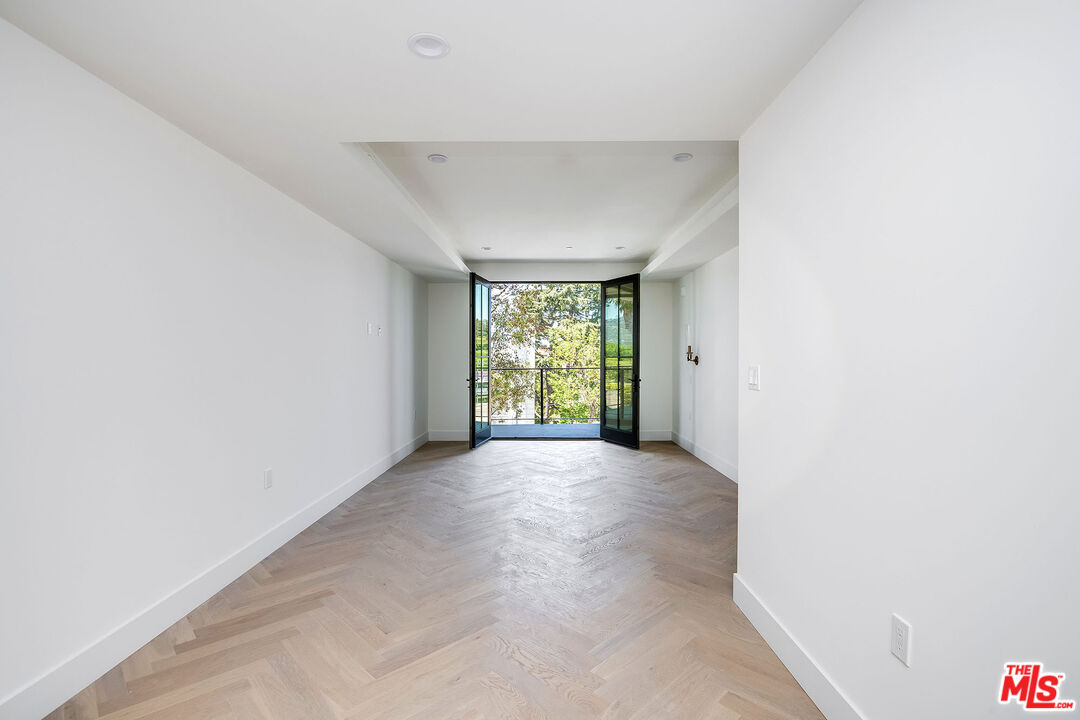 10352 Riverside Drive, Unit 301 Toluca Lake, CA 91602 - Photo 15 of 19 a view of an empty room with a window