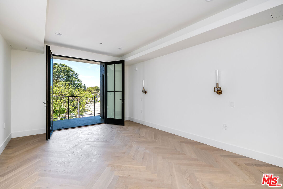 10352 Riverside Drive, Unit 301 Toluca Lake, CA 91602 - Photo 17 of 19 a view of a big room with large windows