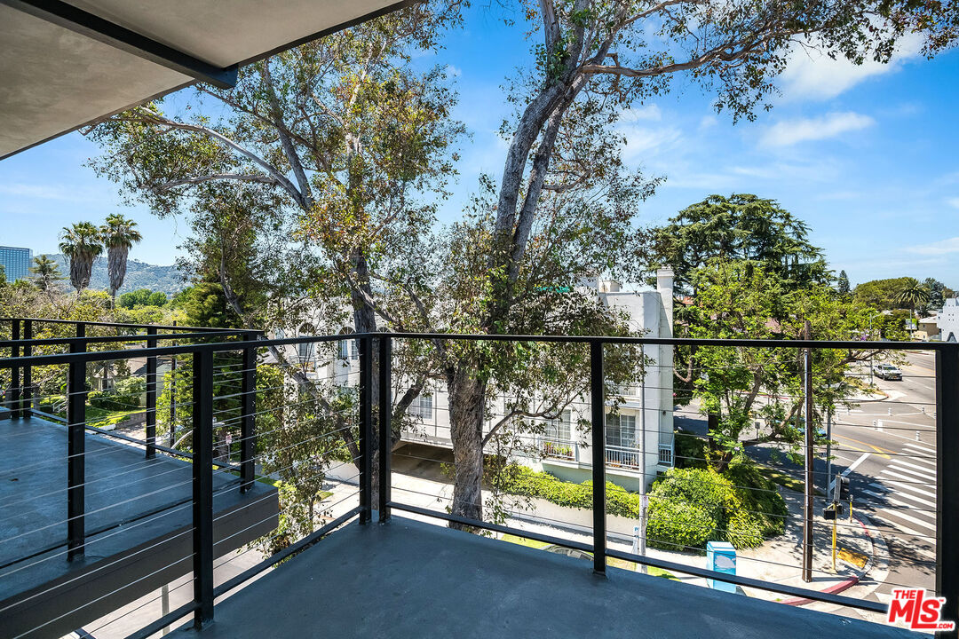 10352 Riverside Drive, Unit 301 Toluca Lake, CA 91602 - Photo 18 of 19 a view of a balcony with lake view