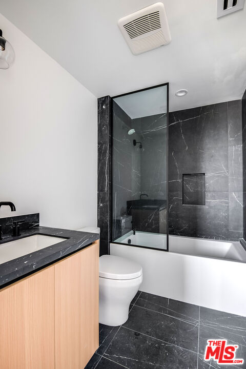 10352 Riverside Drive, Unit 301 Toluca Lake, CA 91602 - Photo 19 of 19 a bathroom with a sink a toilet and a shower