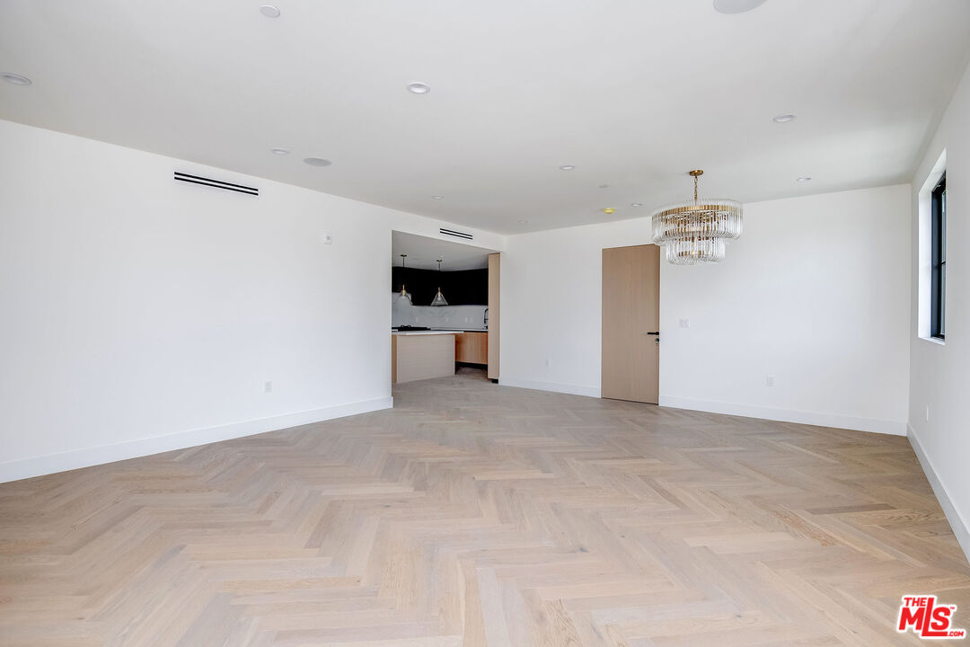 10352 Riverside Drive, Unit 301 Toluca Lake, CA 91602 - Photo 10 of 19 a view of a big room with closet and windows