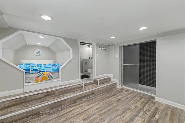 a bathroom with a toilet a sink and a mirror