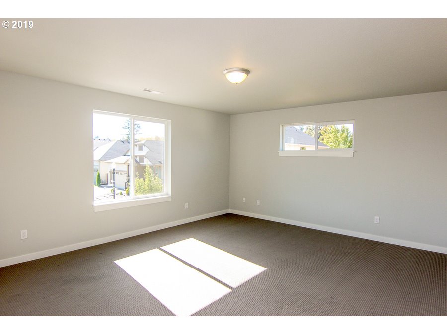 3002 Northeast 171st Street Ridgefield, WA 98642 - Photo 14 of 32 a view of an empty room with a window
