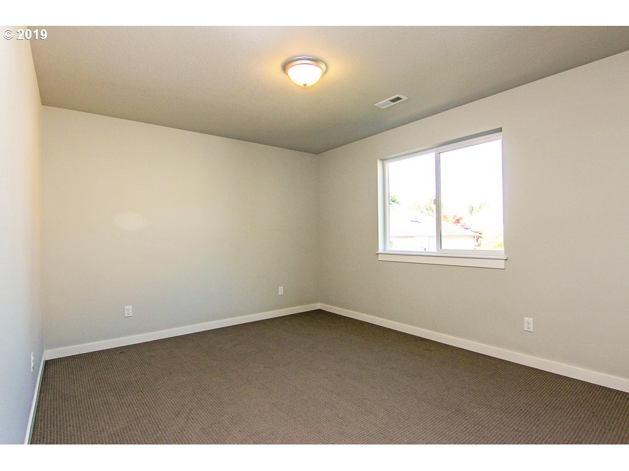 3002 Northeast 171st Street Ridgefield, WA 98642 - Photo 24 of 32 a view of an empty room with a window