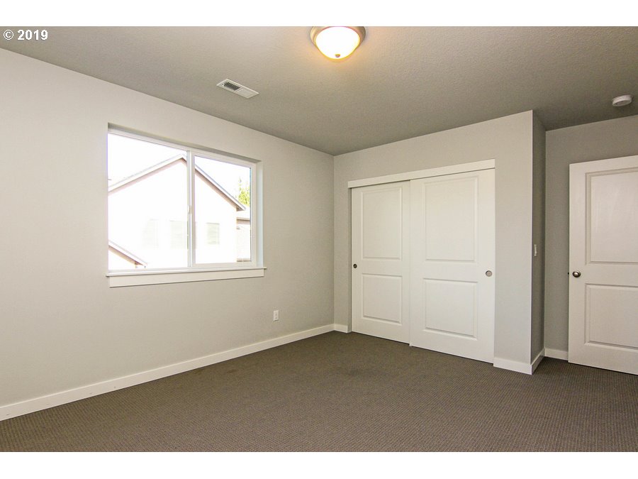 3002 Northeast 171st Street Ridgefield, WA 98642 - Photo 25 of 32 a view of an empty room with a window