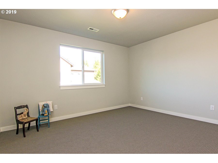 3002 Northeast 171st Street Ridgefield, WA 98642 - Photo 26 of 32 a view of an empty room with a window