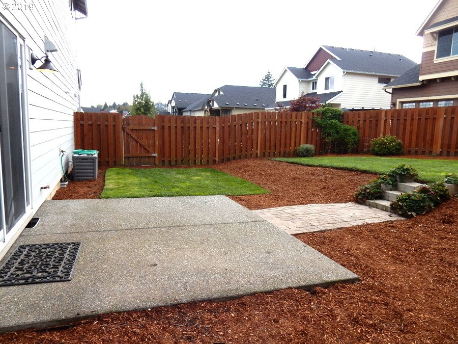 3002 Northeast 171st Street Ridgefield, WA 98642 - Photo 29 of 32 a view of a yard with wooden fence