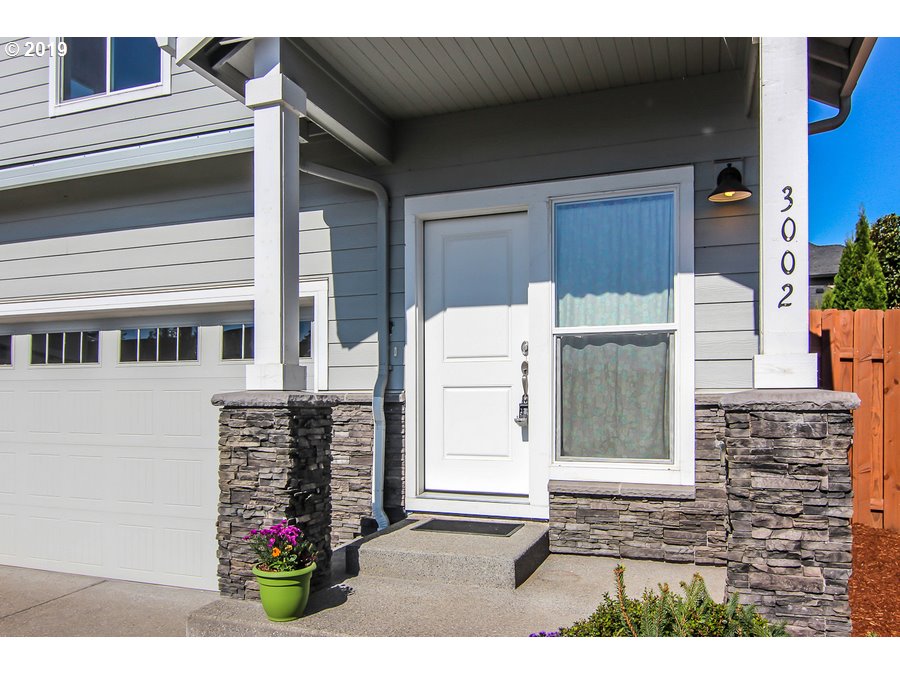 3002 Northeast 171st Street Ridgefield, WA 98642 - Photo 3 of 32 a view of a house with a potted plant