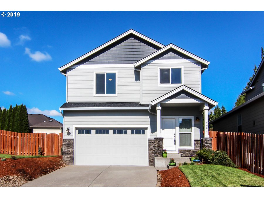 3002 Northeast 171st Street Ridgefield, WA 98642 - Photo 32 of 32 a front view of a house with a yard