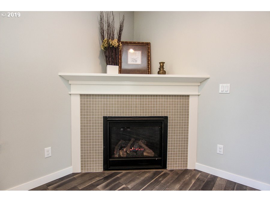 3002 Northeast 171st Street Ridgefield, WA 98642 - Photo 7 of 32 a living room with a fireplace