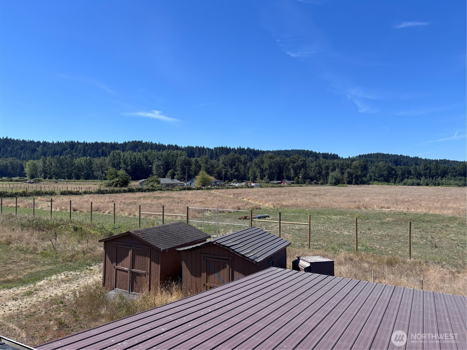 20016 Orville Road East Orting, WA 98360 - Photo 2 of 18 a view of house with lake and mountain view