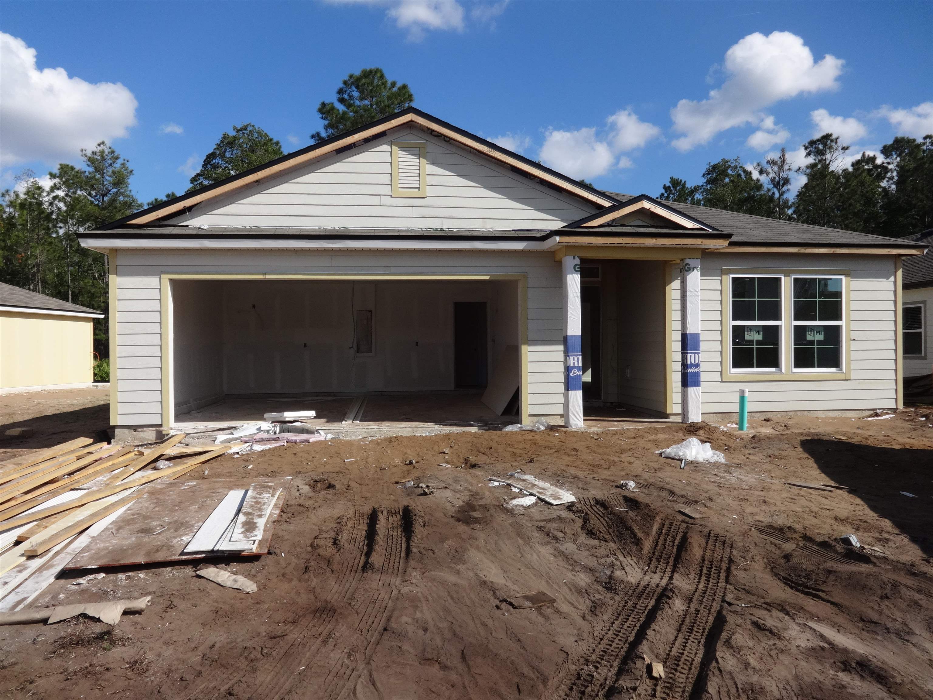 92 Falcon Ridge Road St. Augustine, FL 32084 - Photo 1 of 16 a front view of a house with a yard