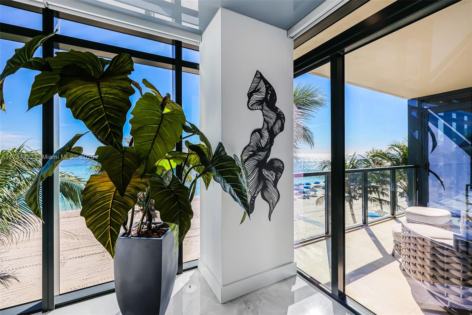 2205 South Surf Road, Unit 4A Hollywood, FL 33019 - Photo 15 of 71 a vase of flowers sitting on a floor in front of a window