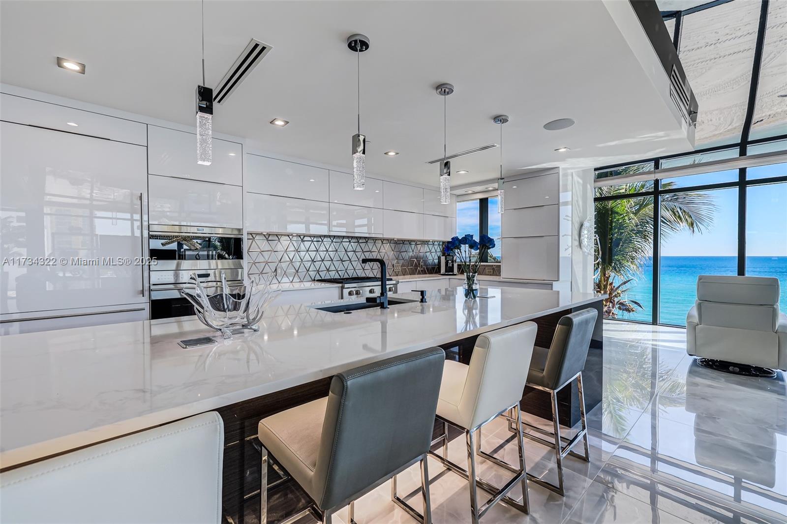 2205 South Surf Road, Unit 4A Hollywood, FL 33019 - Photo 34 of 71 a kitchen with stainless steel appliances granite countertop a sink a stove and a refrigerator