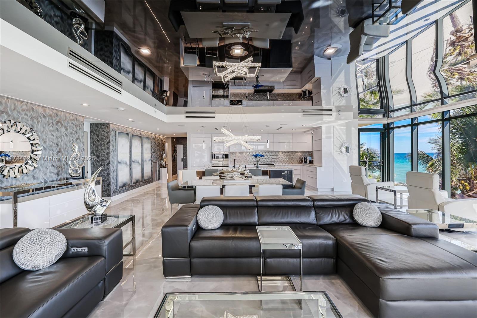 2205 South Surf Road, Unit 4A Hollywood, FL 33019 - Photo 39 of 71 a living room with furniture and a chandelier