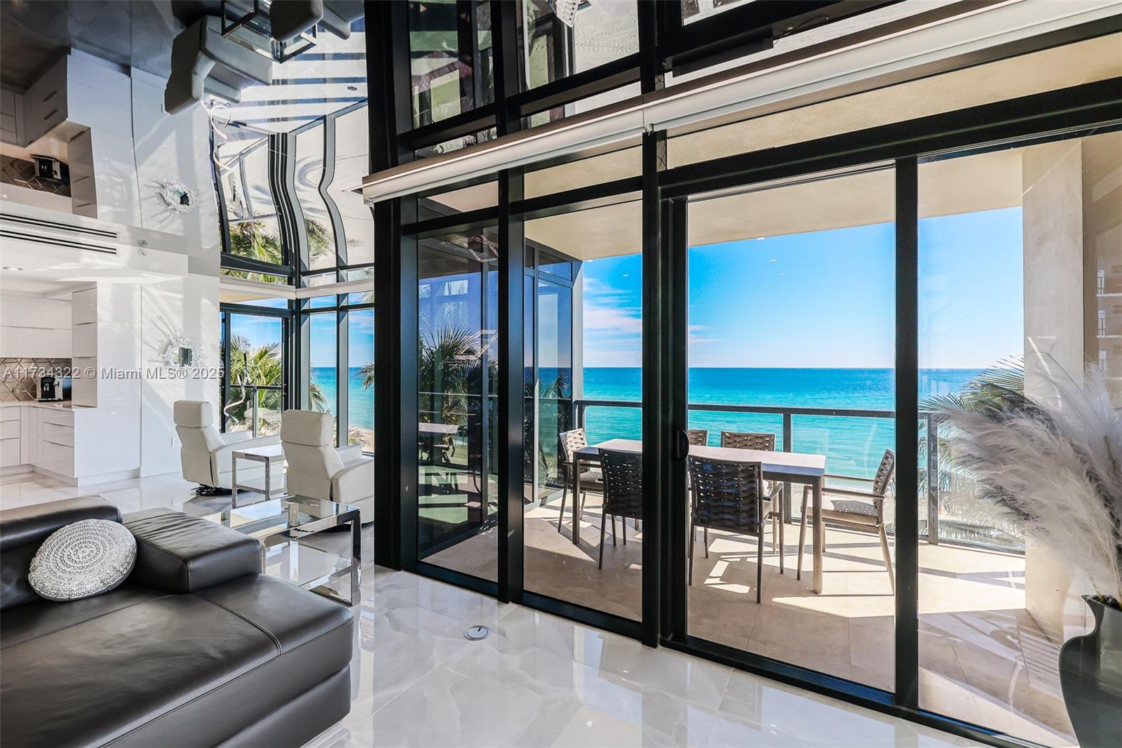 2205 South Surf Road, Unit 4A Hollywood, FL 33019 - Photo 40 of 71 a living room with furniture and a floor to ceiling window