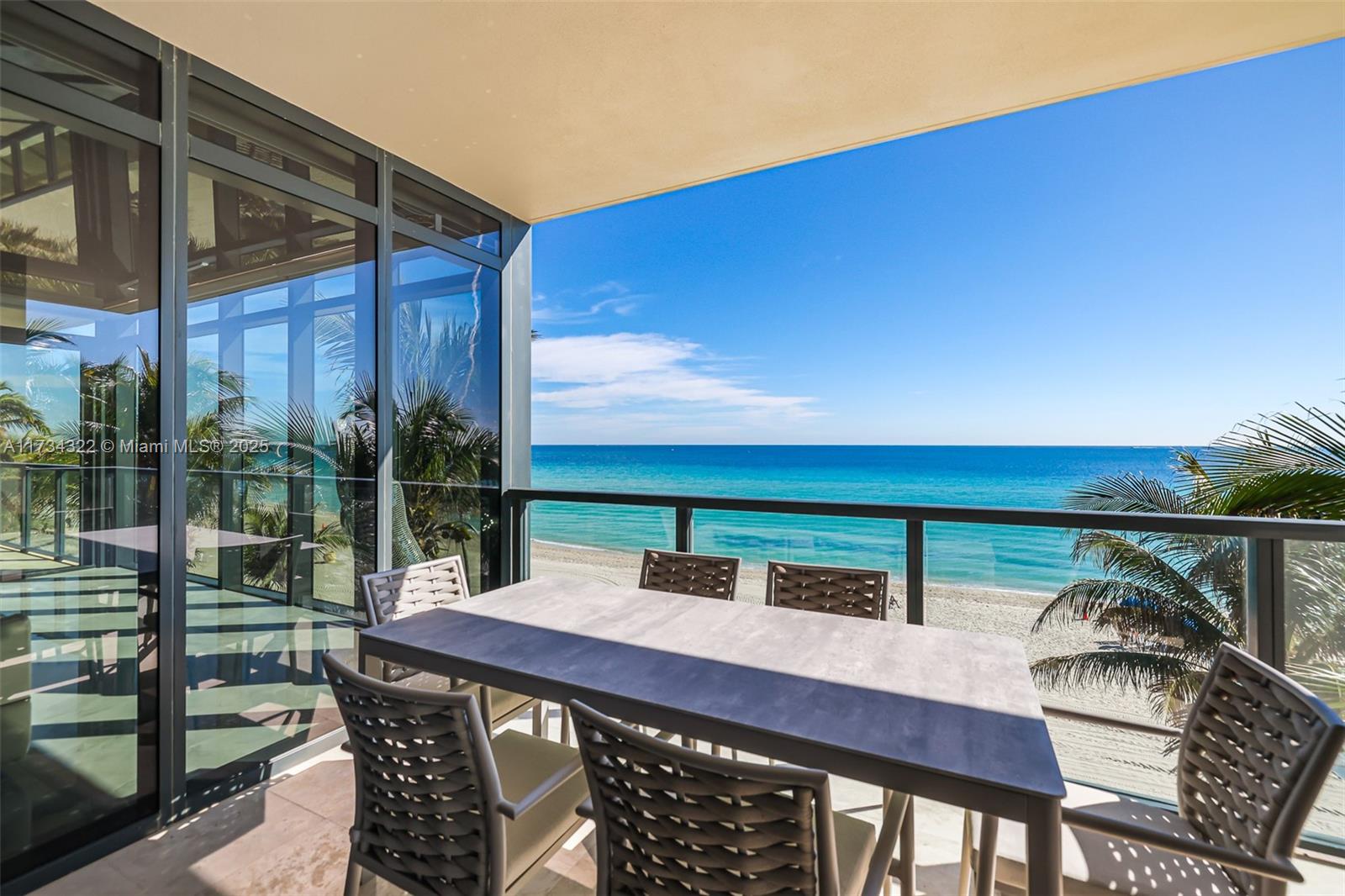 2205 South Surf Road, Unit 4A Hollywood, FL 33019 - Photo 42 of 71 a view of balcony with wooden floor and outdoor seating