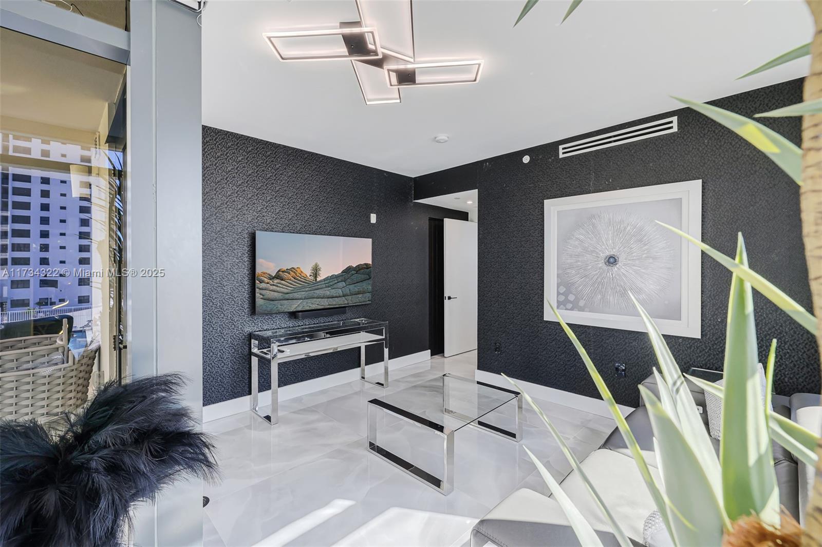 2205 South Surf Road, Unit 4A Hollywood, FL 33019 - Photo 48 of 71 a living room with furniture and a flat screen tv