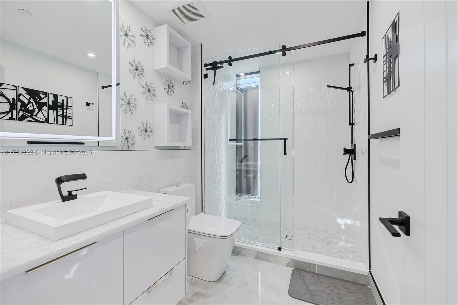 2205 South Surf Road, Unit 4A Hollywood, FL 33019 - Photo 50 of 71 a bathroom with a sink a toilet and shower