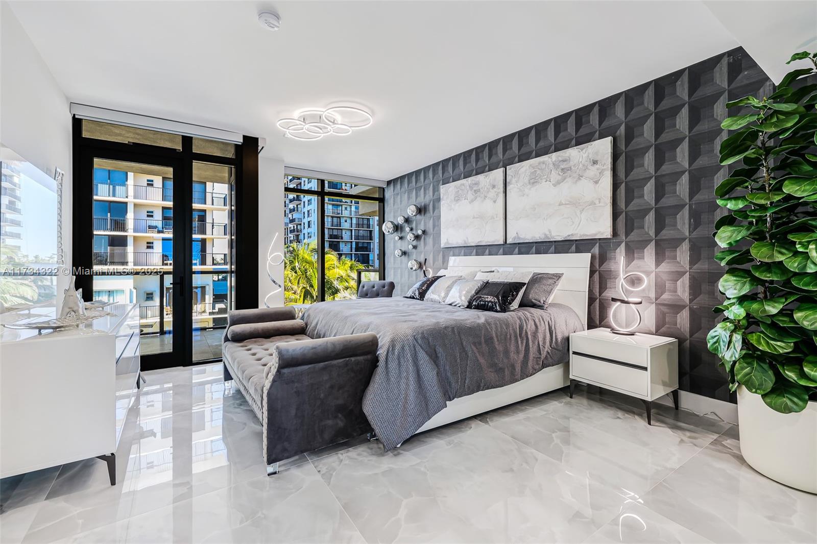 2205 South Surf Road, Unit 4A Hollywood, FL 33019 - Photo 51 of 71 a bedroom with a bed and a couch