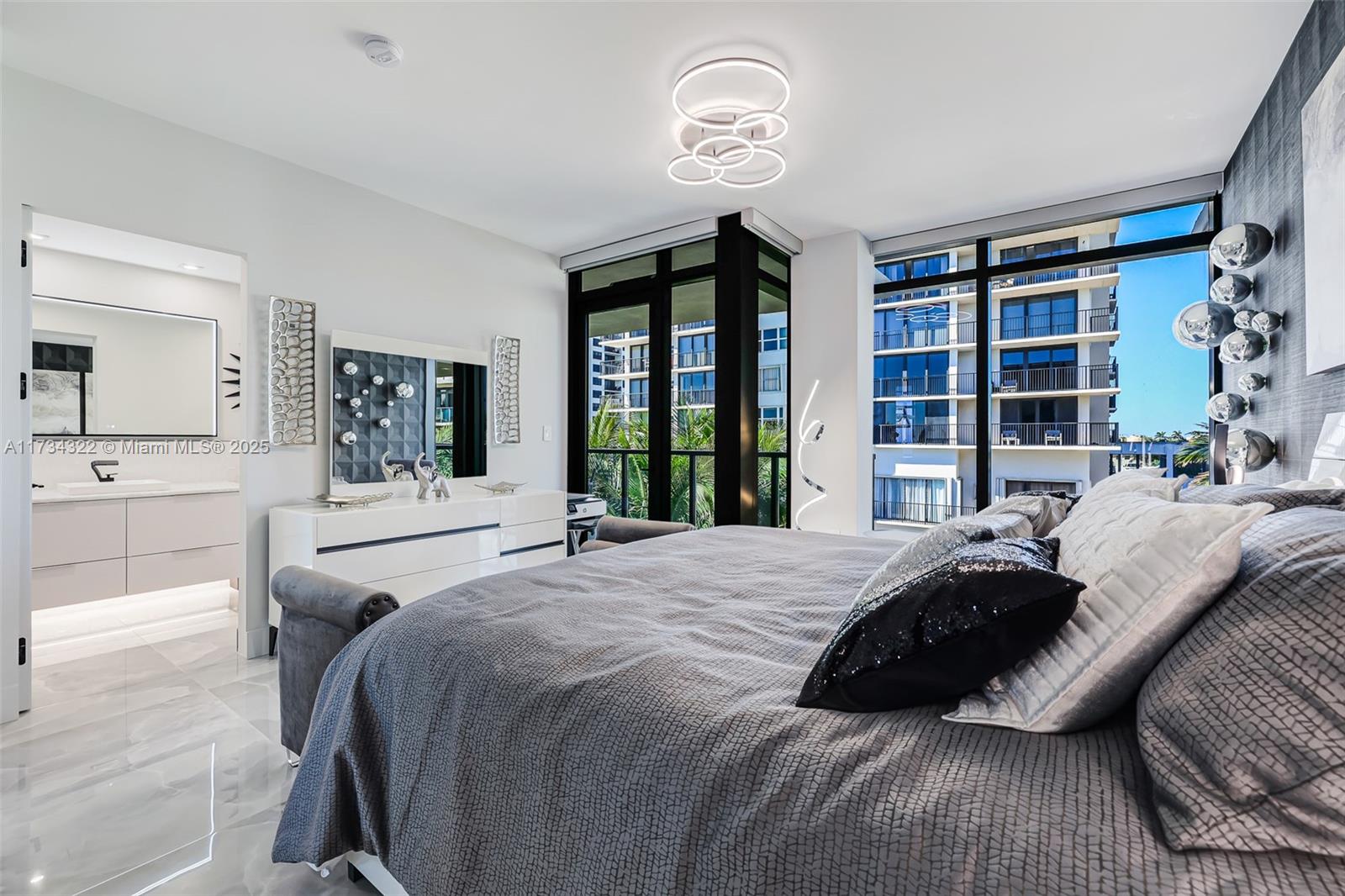 2205 South Surf Road, Unit 4A Hollywood, FL 33019 - Photo 52 of 71 a bedroom with a large bed and a large window