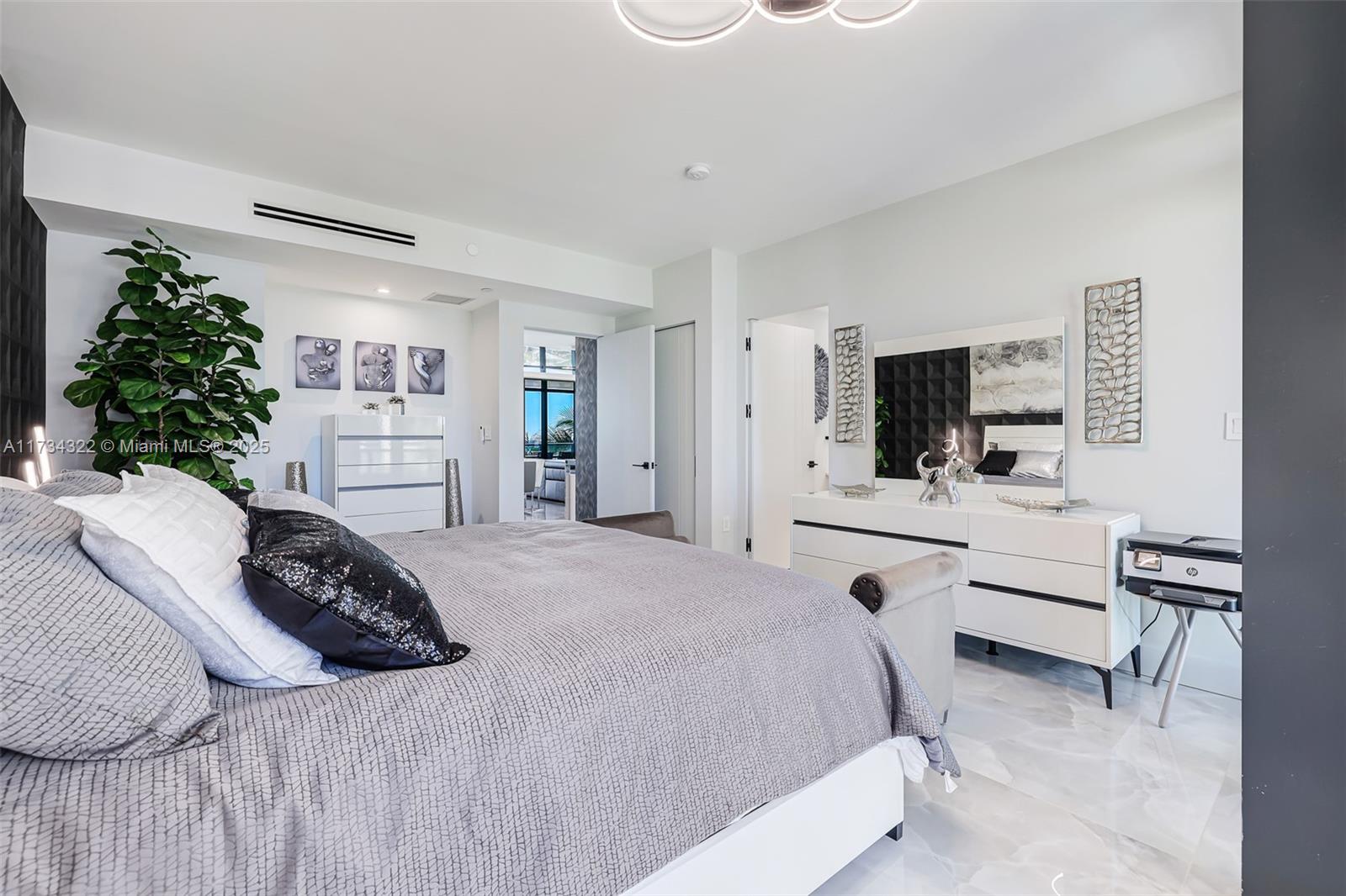 2205 South Surf Road, Unit 4A Hollywood, FL 33019 - Photo 53 of 71 a bedroom with a bed flat screen tv and a couch