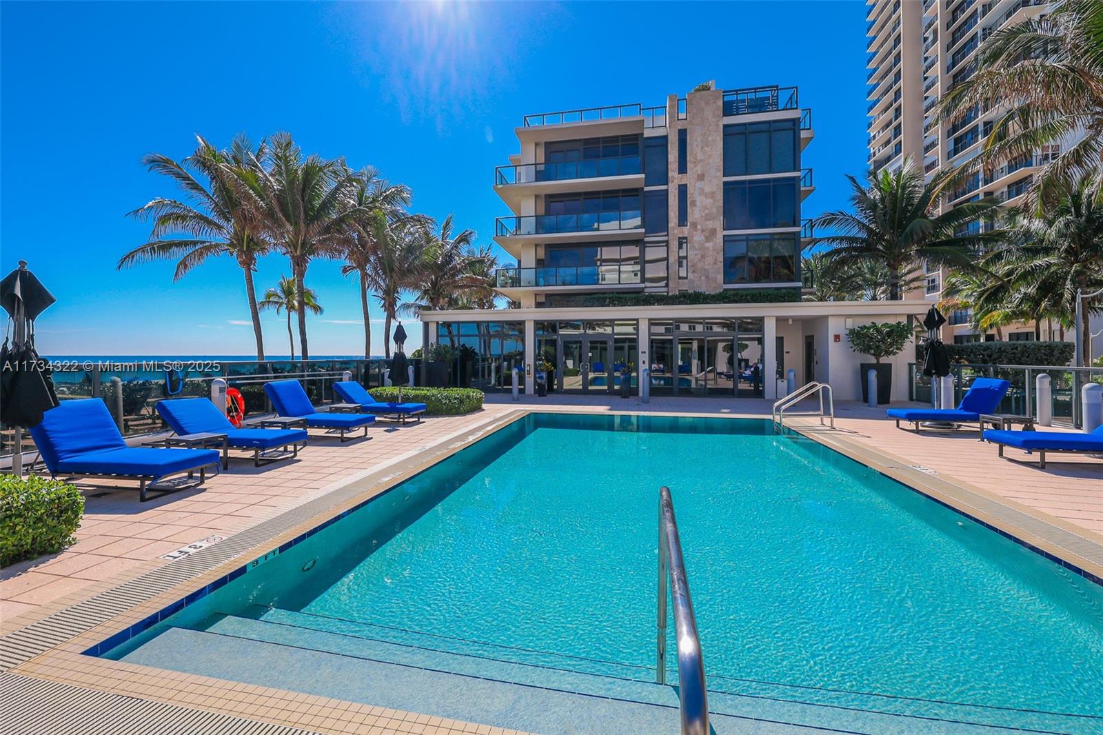 2205 South Surf Road, Unit 4A Hollywood, FL 33019 - Photo 60 of 71 a view of a swimming pool with chairs