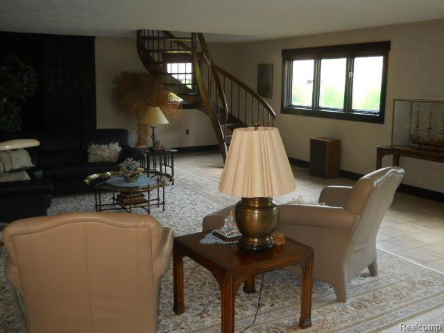 2828 Chilson Road Howell, MI 48843 - Photo 28 of 79 living rm w/spiral staircase
