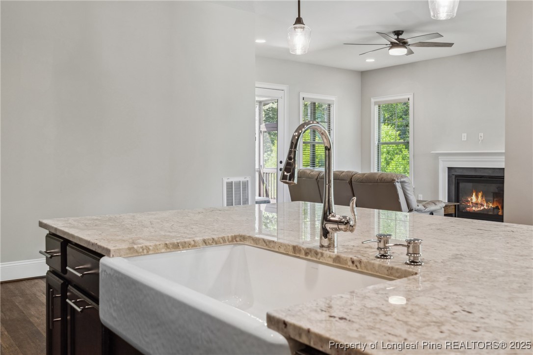 405 Gilpin Way Cary, NC 27519 - Photo 11 of 34 a bathroom with a granite countertop sink and a bathtub