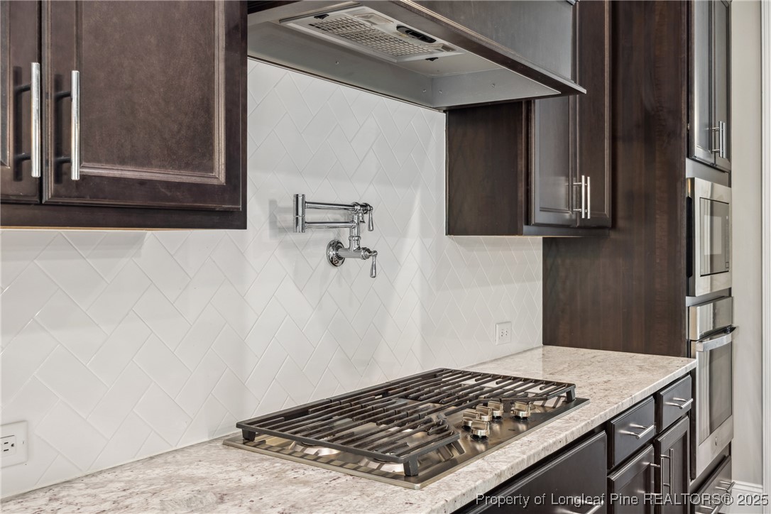 405 Gilpin Way Cary, NC 27519 - Photo 13 of 34 a kitchen with a stove and a refrigerator