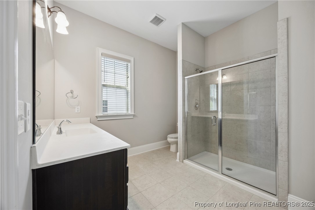 405 Gilpin Way Cary, NC 27519 - Photo 18 of 34 a bathroom with a sink and a mirror