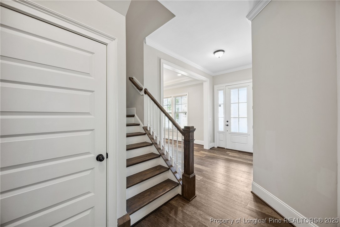 405 Gilpin Way Cary, NC 27519 - Photo 20 of 34 a view of entryway and hall with wooden floor