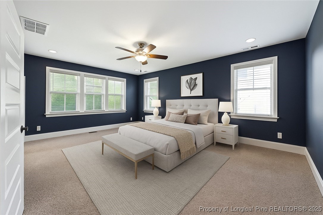 405 Gilpin Way Cary, NC 27519 - Photo 22 of 34 a bedroom with a large bed and a window