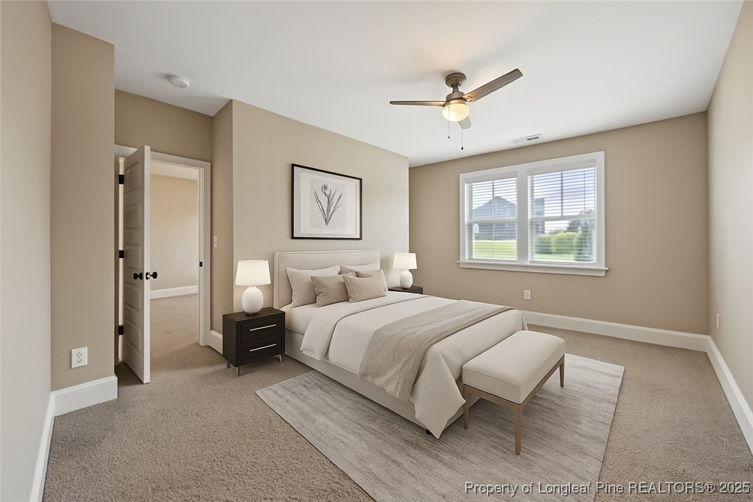 405 Gilpin Way Cary, NC 27519 - Photo 26 of 34 a bedroom with a bed and a painting on the wall