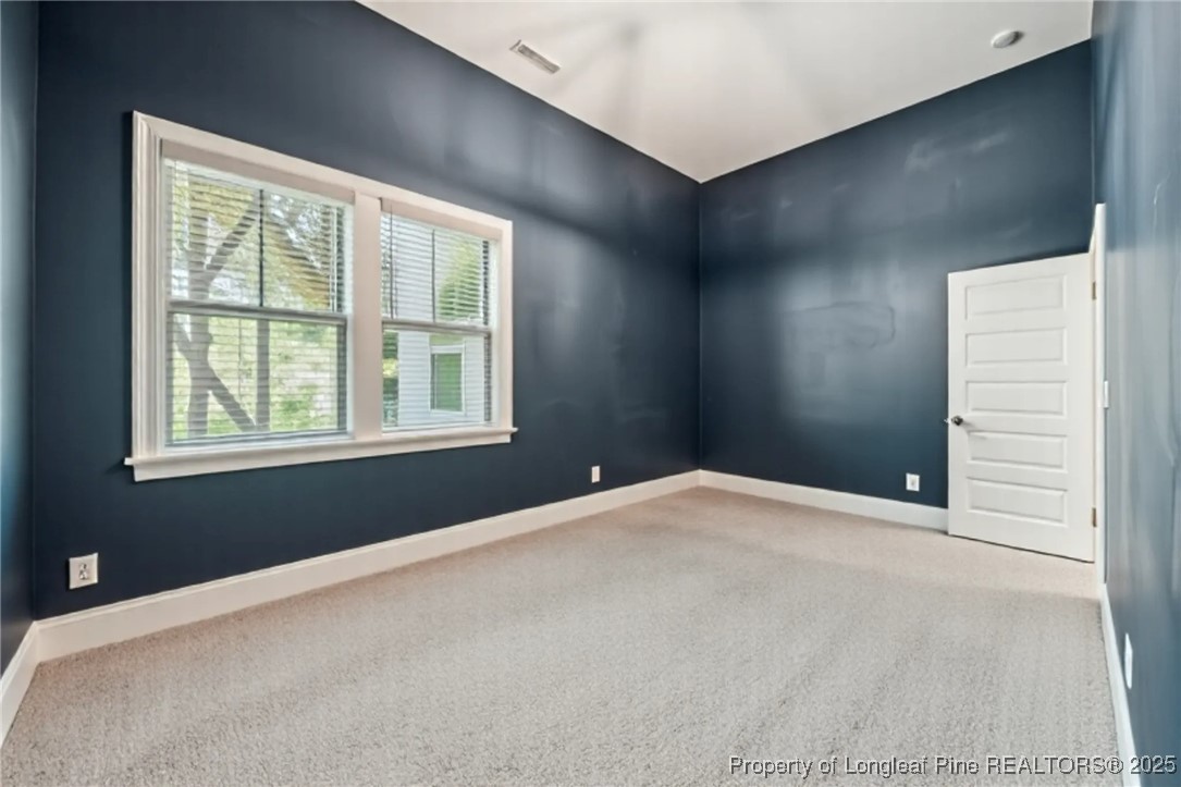 405 Gilpin Way Cary, NC 27519 - Photo 31 of 34 a bedroom with a bed and a window