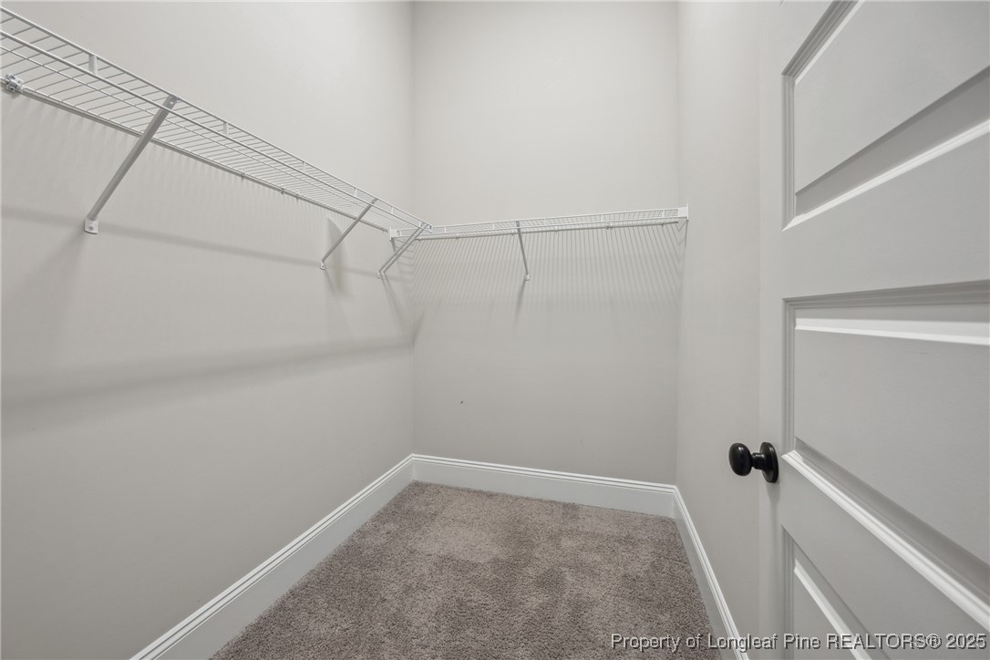 405 Gilpin Way Cary, NC 27519 - Photo 32 of 34 a view of a room with racks on the wall