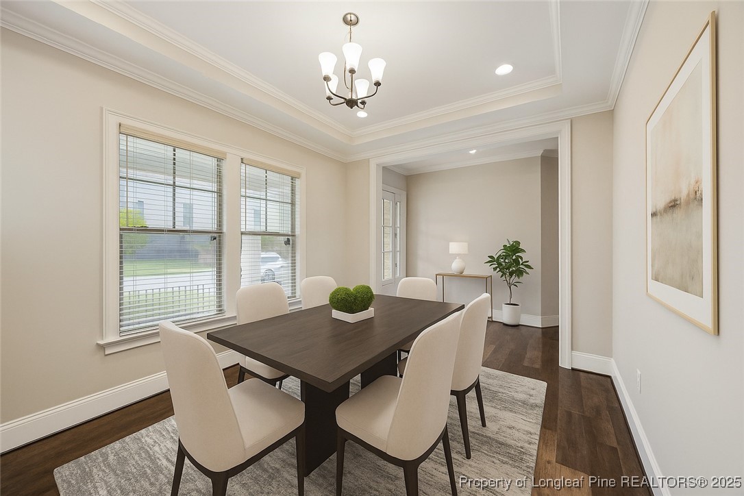 405 Gilpin Way Cary, NC 27519 - Photo 10 of 34 a view of a dining room with furniture window and wooden floor