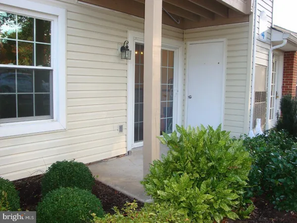 a view of a kitchen with wooden floor and a kitchen