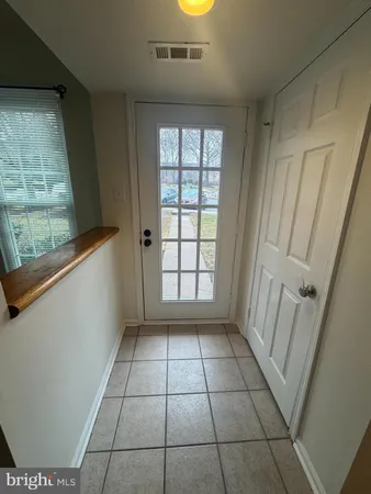 a view of empty room with windows